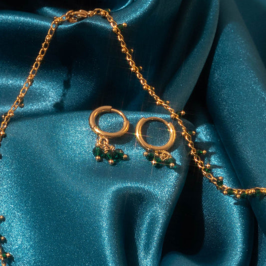 An image of our Hina Hoops next to the Hina Necklace 